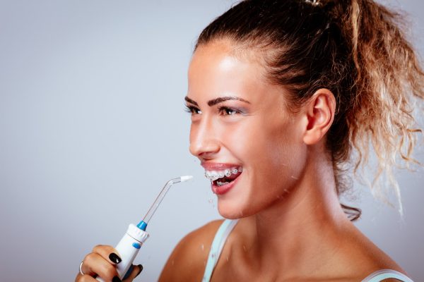 Why Should You Use Water Flossers with Flossing